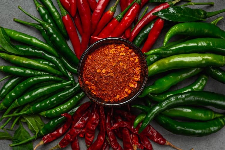 Red chilli paste on a black background.